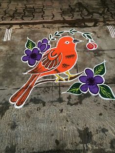 a bird painted on the ground with flowers