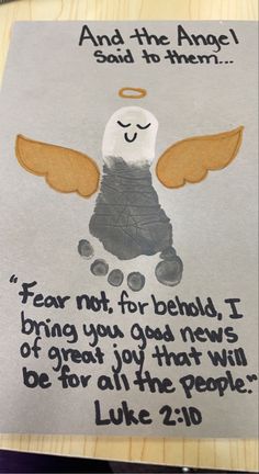 an angel handprinted on a piece of paper with the words, fear not for behold i bring you god that will be for all the people luke 2 16