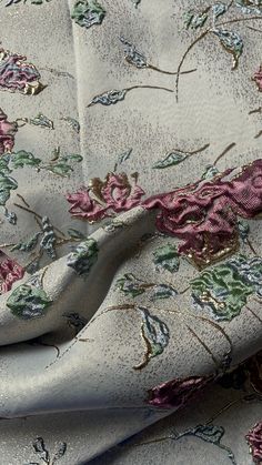 the fabric is very pretty with flowers and leaves on it's side, as well as metallic foil