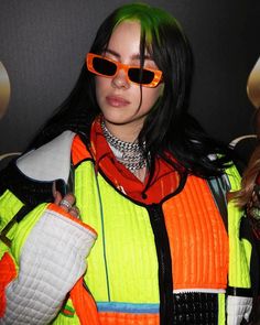 two women with green hair and orange sunglasses