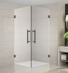 a glass shower door in a bathroom