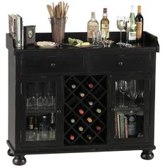 a black bar with wine glasses and bottles on the top, next to an assortment of liquors