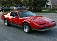 a red sports car parked in a parking lot