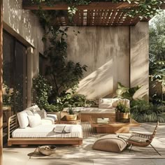 an outdoor living area with furniture and plants