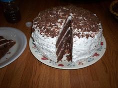 a chocolate cake with one slice cut from it