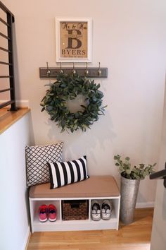 the entryway is clean and ready to be used as a storage area for shoes