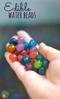 someone is holding some colorful beads in their hand with the words edible water beads on it