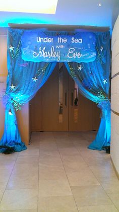 under the sea with madly eye stage set up for an event or party, it looks like something out of a fairy tale