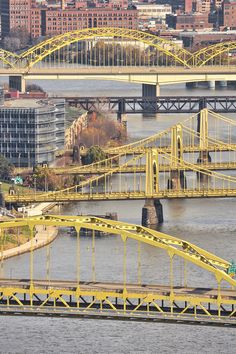 an aerial view of a bridge spanning the width of a river