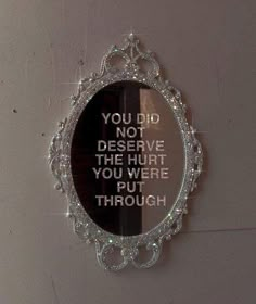 a mirror that has some type of writing on the side of it with words written in front of it