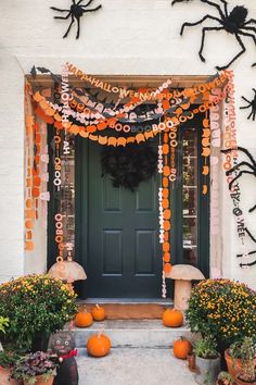 a front door decorated for halloween with decorations