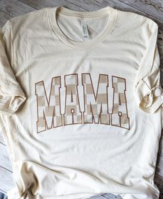 Are you a proud mama looking for a stylish way to show off your love for motherhood? Look no further! Our Mama Shirt is the perfect blend of comfort and chic. Printed on Bella Canvas Brand T-shirts. These are the most comfortable fabrics and perfect for layering or these warm spring and summer days! Mama Vinyl Decals, Custom Mom Shirts, Brown Gingham, Newnan Ga, Mama Tee, Gingham Shirt, Warm Spring, Mama Shirts, Christmas 2024