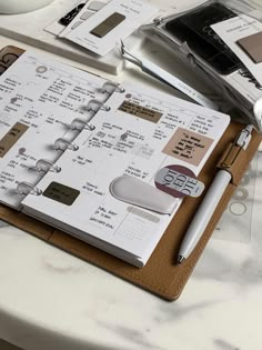 an open planner sitting on top of a table