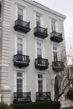 an apartment building with balconies and wrought iron balcony railings