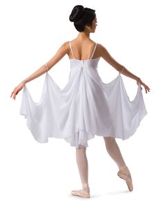 a woman in a white dress and ballet shoes