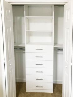 an empty white closet with drawers and shelves on the bottom shelf is pictured in this image