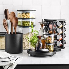 kitchen utensils and spices are arranged on the counter