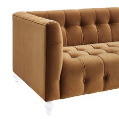 a brown couch sitting on top of a white floor