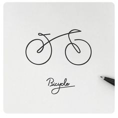 a drawing of a bicycle on top of a piece of paper next to a pen