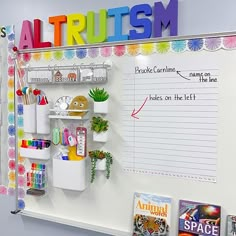 a bulletin board with writing on it and magnets attached to the wall above it