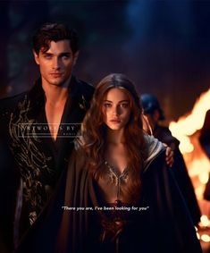 the vampire and his beautiful lady are standing in front of an open fire with their arms around each other