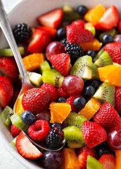 a close up of a bowl of fruit salad