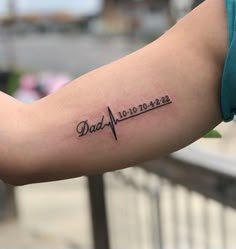 a person's arm with a tattoo that reads, dad 1010 - 1232