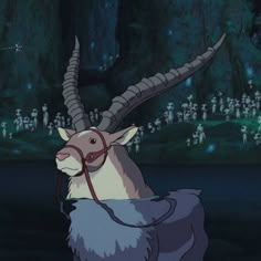 an animal with long horns standing in the dark