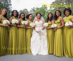 a bride and her bridal party posing for a photo