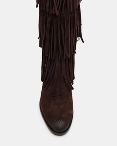 Upgrade your wardrobe with the SPUR fringe boot. These boots feature a fringe detailing that adds a touch of effortless style. Perfect for any occasion, these boots will elevate your look while providing comfort and durability. 1 inch heel height 14.5 inch shaft circumference 15 inch shaft height Suede upper material Synthetic lining Leather sock Synthetic sole Fit tip: If you are in between sizes, size up a half-size Imported Leather Fringe Boots For Fall, Winter Fringe Ankle Boots, Western Suede Fringe Boots, Western Style Suede Boots With Fringe, Western Fringe Boots For Fall, Brown Fringe Winter Boots, Suede Fringe Boots, Weekend Work, Fringe Boots