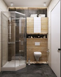 a bathroom with a walk in shower next to a white toilet and stand up shower