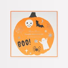 an orange pumpkin with halloween decorations on it, and the words boo written in black