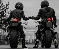 two motorcyclists in black leather jackets on their motorcycles with red tail lights