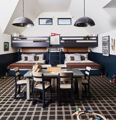 two bunk beds in a room with black and white checkered carpeting on the floor