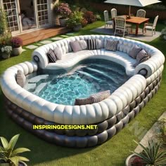 an inflatable swimming pool is shown with chairs and tables on the lawn next to it