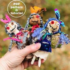 a person holding three small dolls in their hand with the text free pattern and video below