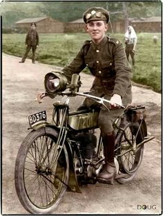 an old photo of a man in uniform on a motorcycle