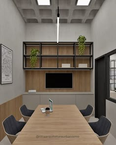 an empty conference room with wooden tables and black chairs in front of a flat screen tv mounted on the wall