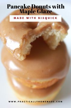 a close up of a glazed donut with maple glaze in the middle and text overlay that reads, pancake donuts with maple glaze made with biscuit