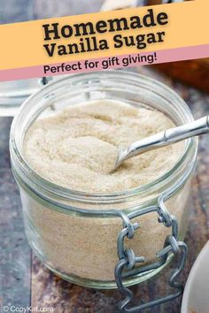 homemade vanilla sugar in a glass jar with a spoon on the side and text overlay reading homemade vanilla sugar perfect for gift giving