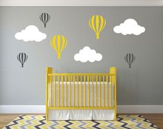 a baby's room with a crib and stars on the wall