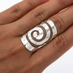 "DON 925's master silversmiths crafted this beautiful ring with genuine sterling silver, it features a spiral design with \"diamond cut\" details (meaning shiny details). This ring under the sunlight sparkles beautifully! Length: 3.3 cm (1.30\") Band width: 9 mm (0.35\") Average weight: 9.2 grams (0.32 oz) Wide rings sometimes require a bigger size. Bands approximately 6 mm (0.23\") wide or more generally require a slightly larger size for most people. Rings with a greater surface area against t Long Rings Silver, Double Spiral Ring, Winding Rings, Flare Ring, Full Finger Ring, Wire Jewelry Rings, Full Finger Rings, Unique Silver Rings, Shield Ring