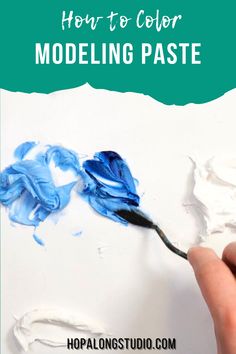 a hand holding a paintbrush with the words how to color modeling paste on it