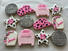 decorated cookies are arranged in the shape of ovens and stars on a sheet of paper