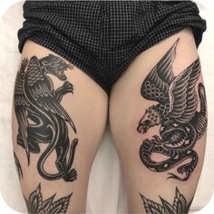 a woman's legs with tattoos on them and an eagle, dragon and snake