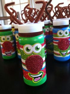 the sesame street bottle is decorated with glittery eyes and an owl face on it