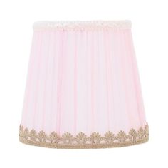 a pink lamp shade with gold trim