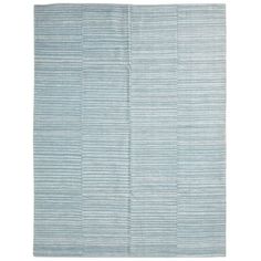 a blue rug with vertical stripes on the bottom, and an area rug in the middle