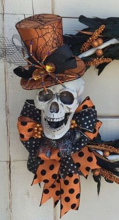 a skeleton wearing a top hat with orange and black decorations