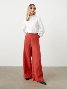 "Accentuated waistline and wide, flowy leg style -- enjoy effortless elegance with these flared linen pants. High waist is emphasized by very clean front side. No pockets, no buttons or straps, just hidden zipper to maintain this cleanliness. Very similar to our beloved pants WANTED, just slightly less flared. STYLE DETAILS * Regular fit * Flare cut * High waist with elastic back line * Hidden zipper * No pockets * Full length * Made from medium linen SIZES & COLORS IN THE PICTURES * Model wears size S in color Rooibos and size S in color Dark Grey. She is 176 cm (5'9\"). Bust - 83 cm (33\"), waist - 60 cm (24\"), hips - 89 cm (35\").  NOTES ON SIZING & COLORS * Please note that linen shrinkage during the softening process cannot be predicted precisely. Therefore, each piece in the same si Linen Wide Leg Pants For Fall, Fall Linen Wide Leg Pants, Wide Leg Linen Pants For Fall, Flared Linen Pants, Flare Palazzo Pants, Edwardian Blouse, Flared Palazzo, Linen Shirts Women, Pants High Waisted